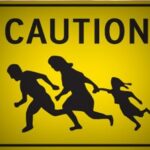 caution sign illegals in roadway
